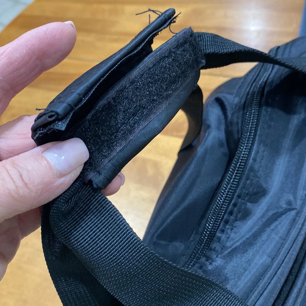 NWOT. Nylon rolling carry-on bag.